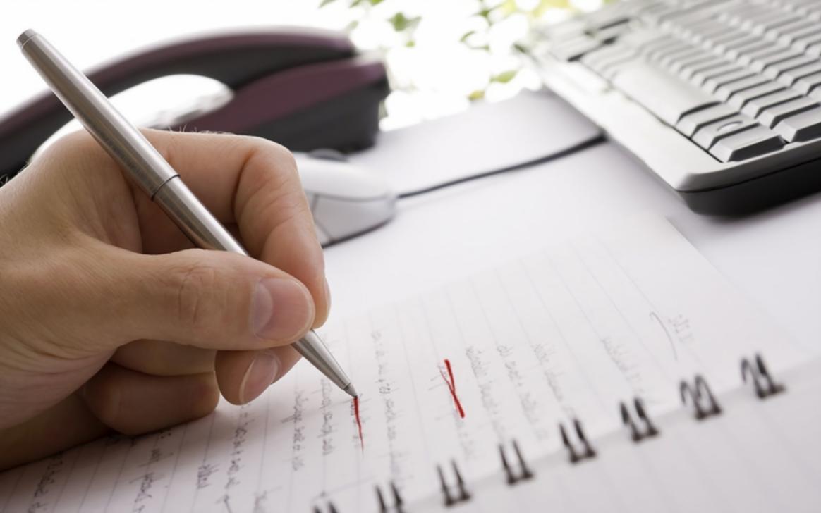 Business professional working through growth strategy materials